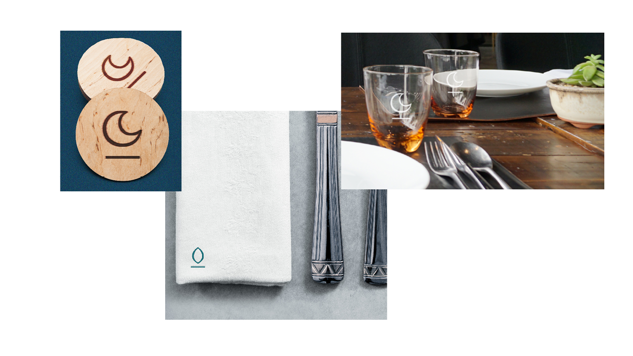 Left to right: Wooden coasters, napkin with silverware, glasses on wooden table.